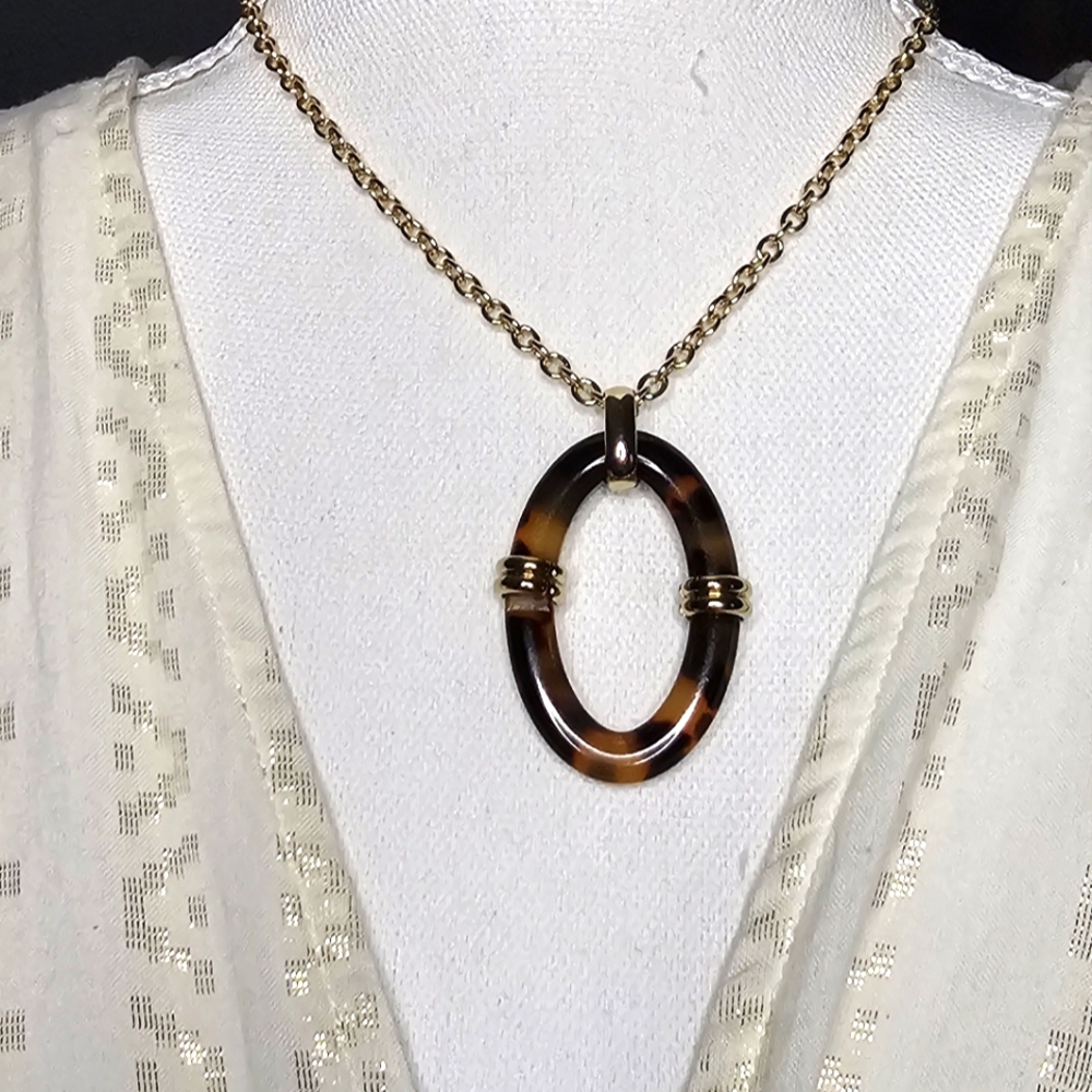 Lauren Ralph LaurenGold Tone Tortoise Pendant Necklace. Matching earrings listed